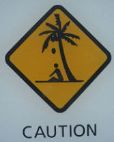 caution sign with coconut falling on head