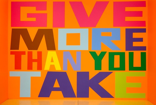 A colourful image that includes only the message, "Give more than you take."