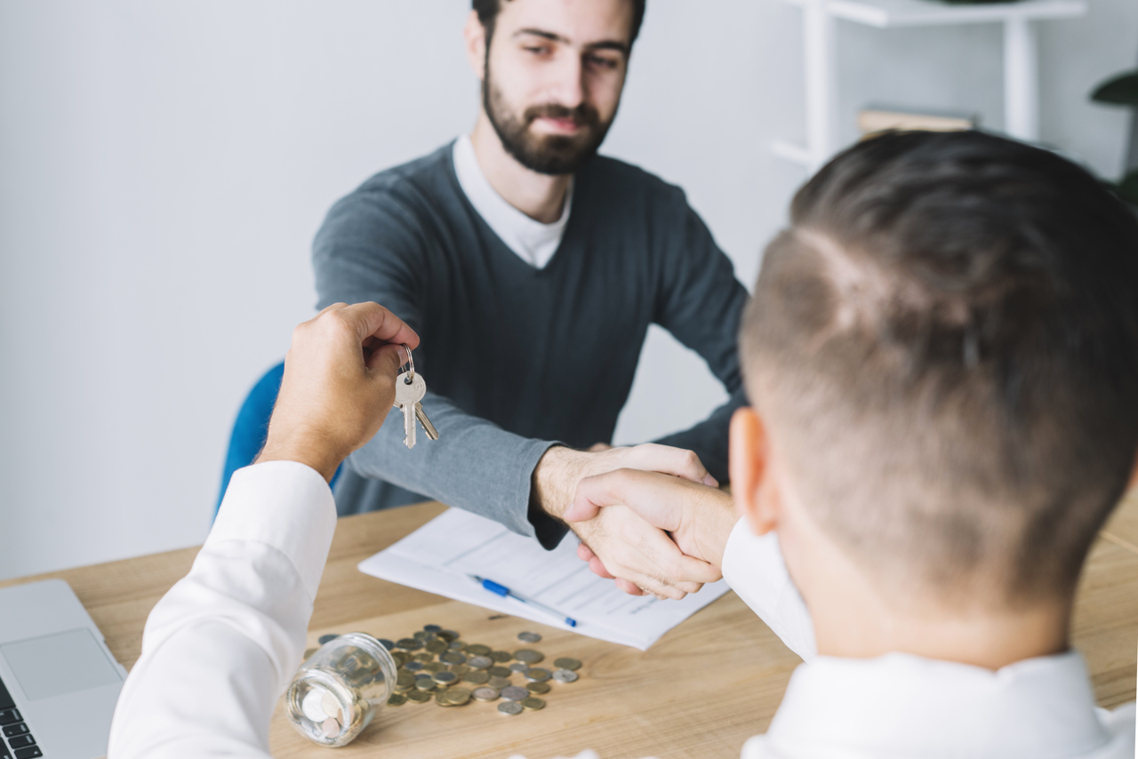 Attachment client-shaking-hand-agent-looking-keys_Easy-Resize.com.jpg